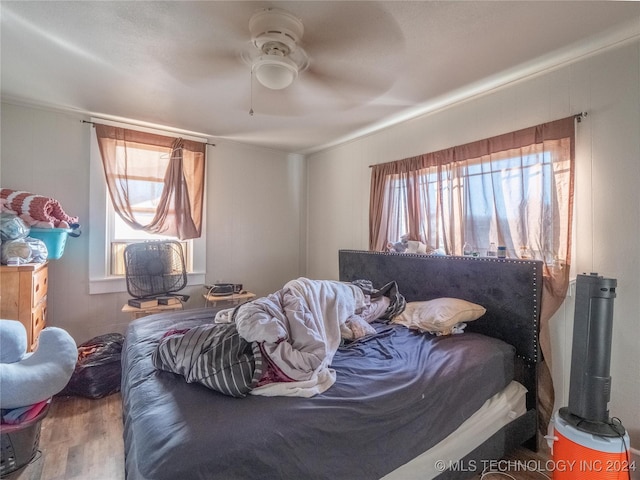 bedroom featuring ceiling fan and hardwood / wood-style floors