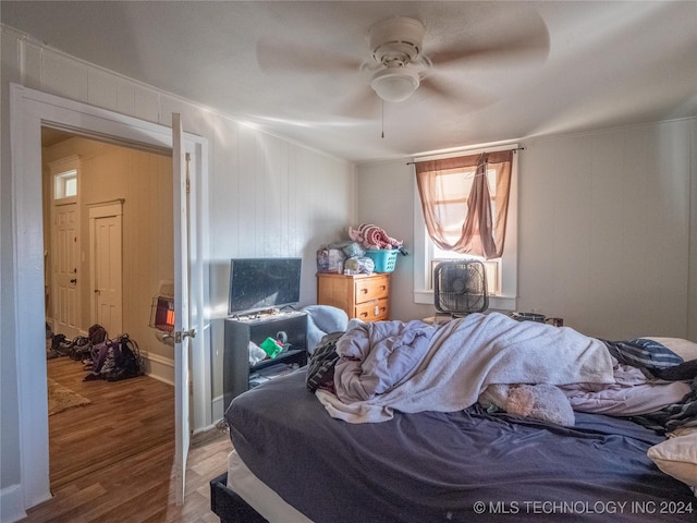 bedroom featuring ceiling fan and hardwood / wood-style floors