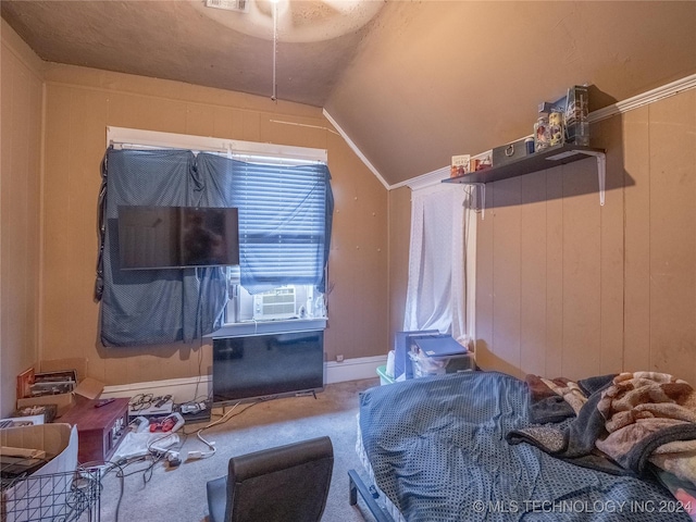 carpeted bedroom with ceiling fan, wooden walls, cooling unit, and lofted ceiling