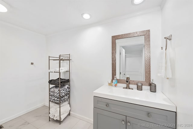 bathroom featuring crown molding and vanity