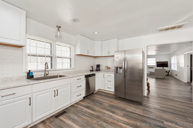 kitchen featuring white cabinets, appliances with stainless steel finishes, and sink