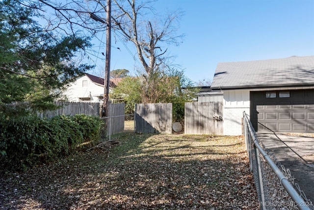 view of yard featuring a garage