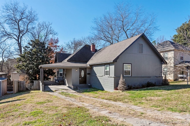 view of front of house with a porch and a front lawn