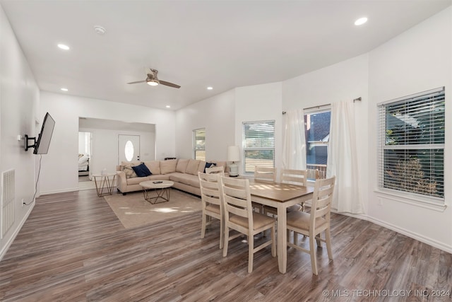 dining space with dark hardwood / wood-style floors and ceiling fan