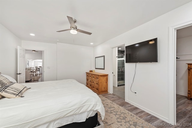 bedroom featuring ceiling fan and wood-type flooring