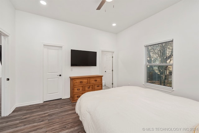 bedroom featuring dark hardwood / wood-style floors and ceiling fan