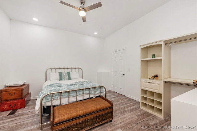 bedroom featuring ceiling fan and light hardwood / wood-style flooring