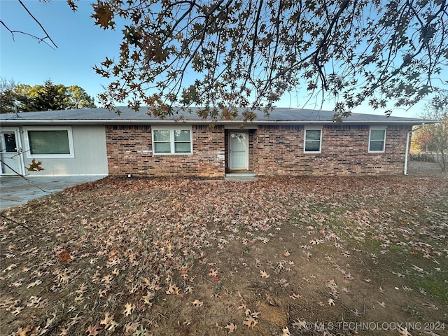 back of property with a patio