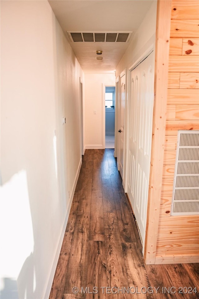 hallway featuring dark wood-type flooring