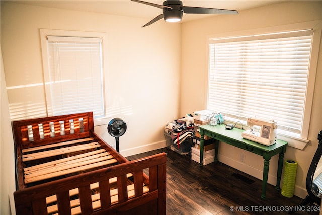 bedroom featuring dark hardwood / wood-style flooring and ceiling fan