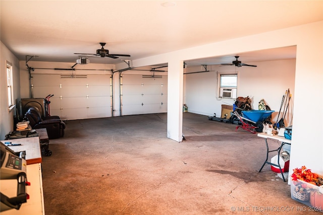 garage with ceiling fan, cooling unit, and a garage door opener