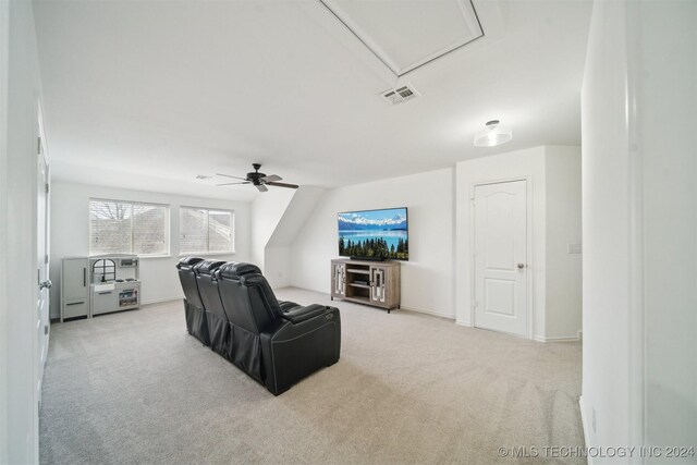 living room featuring light carpet, vaulted ceiling, and ceiling fan