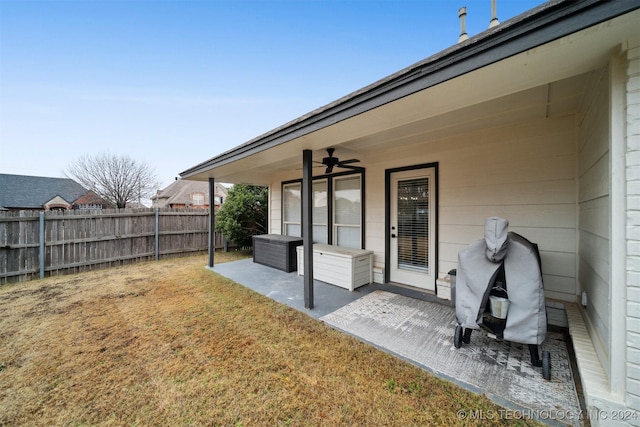 view of yard with a patio area and ceiling fan