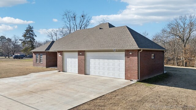 view of side of property featuring a garage