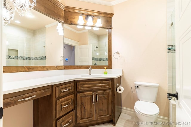 bathroom with vanity, crown molding, a shower with door, and toilet