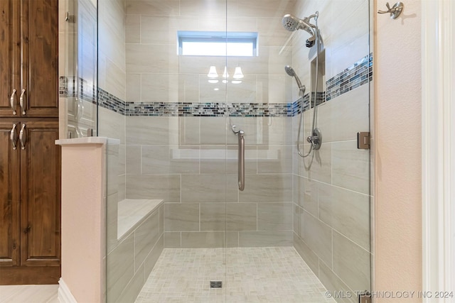 bathroom featuring a shower with door