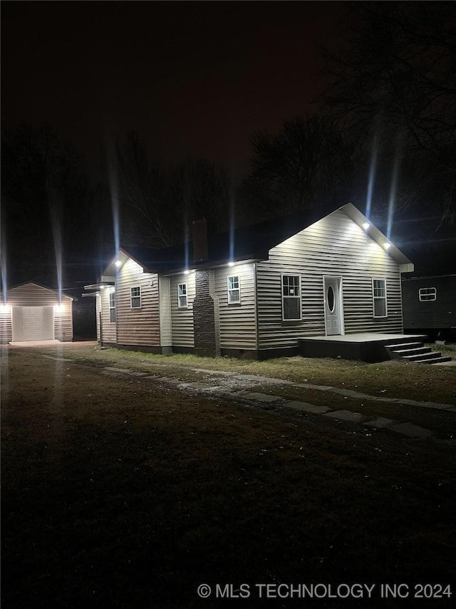 view of front of house with an outbuilding and a garage