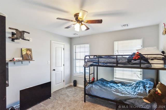 bedroom featuring ceiling fan and light colored carpet