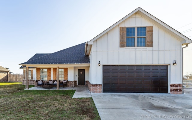 view of front of home with a porch and a front lawn