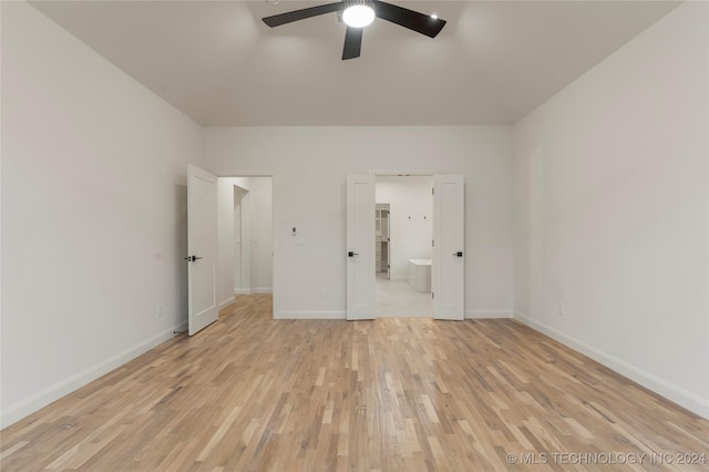 unfurnished bedroom with ensuite bath, ceiling fan, and light hardwood / wood-style floors