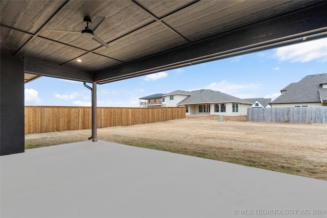 view of yard with a patio and ceiling fan