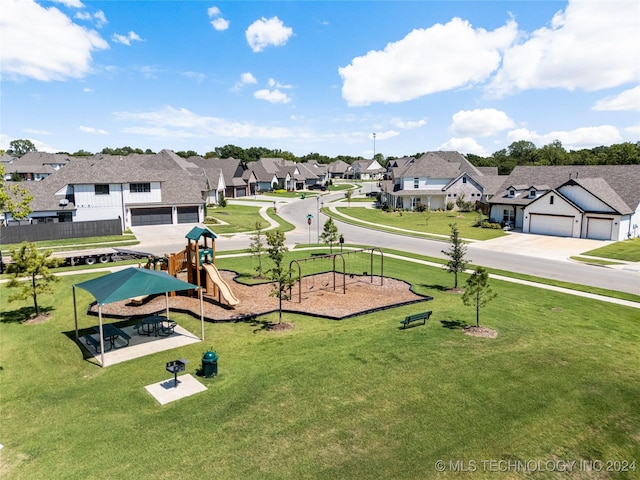 view of community with a playground and a yard