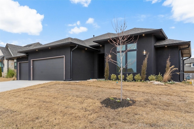 prairie-style home featuring a garage