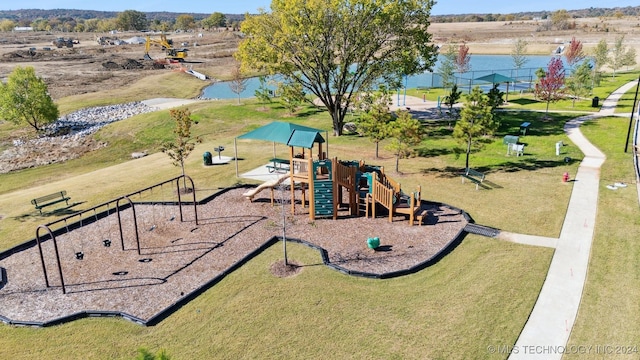 communal playground featuring a lawn and a water view