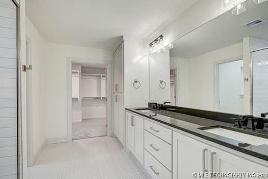 bathroom featuring vanity and walk in shower