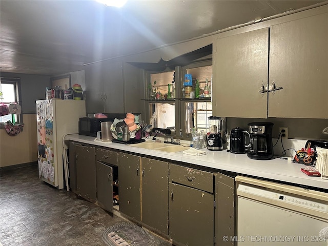 kitchen with white appliances and sink