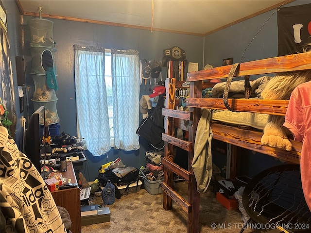 bedroom with carpet flooring and crown molding