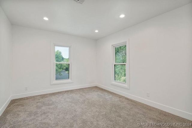 empty room featuring carpet flooring