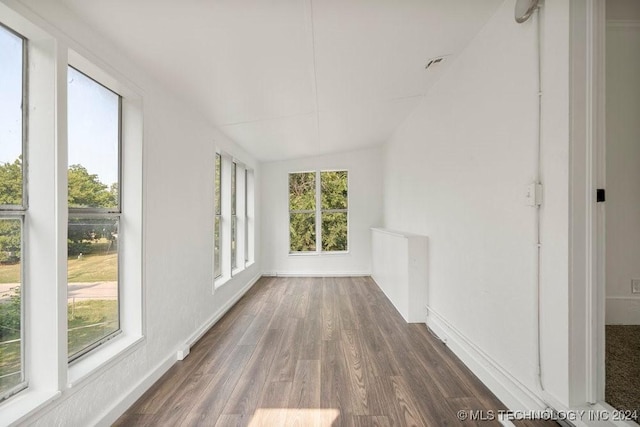 unfurnished sunroom featuring a healthy amount of sunlight and lofted ceiling