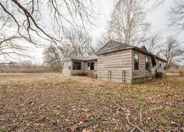 view of property exterior with central AC unit