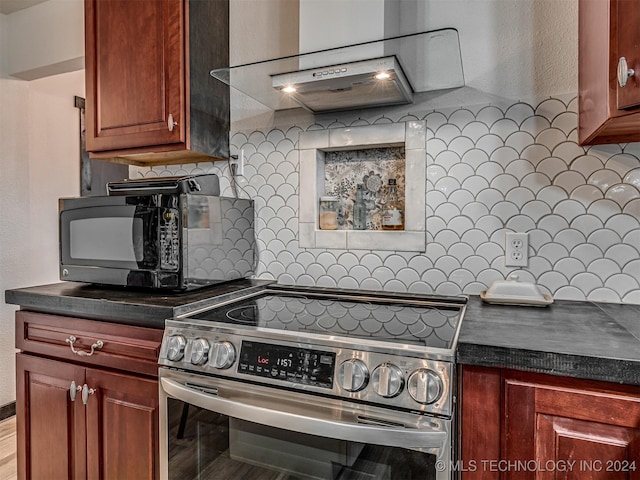 kitchen featuring backsplash and stainless steel electric range oven