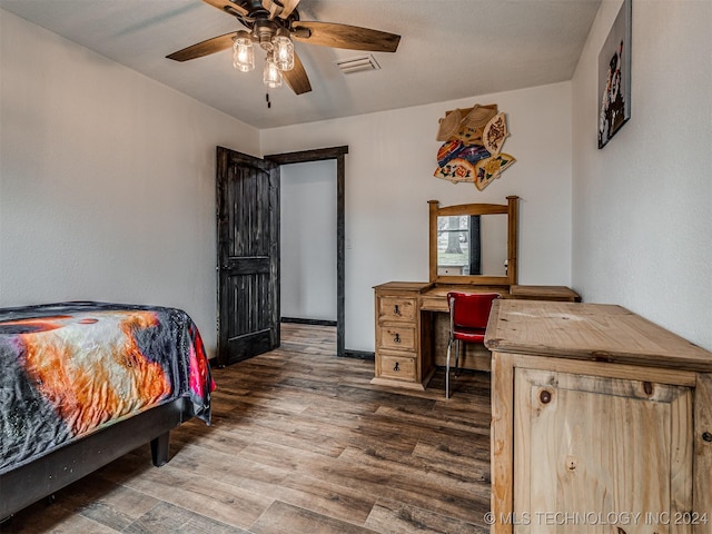 bedroom with hardwood / wood-style floors and ceiling fan