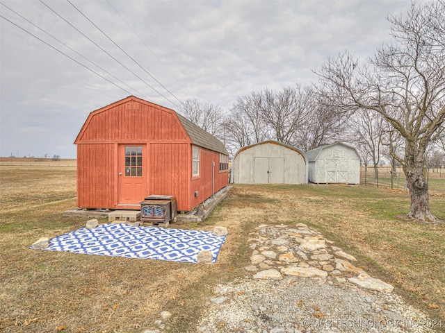 view of outbuilding featuring a yard