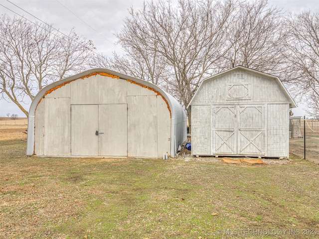 view of outdoor structure featuring a lawn