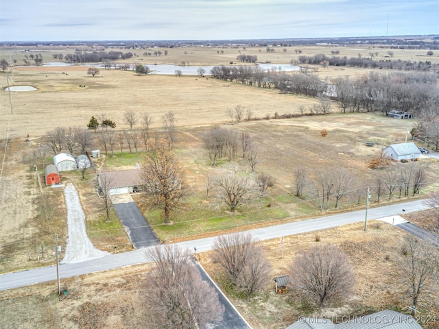 birds eye view of property featuring a rural view