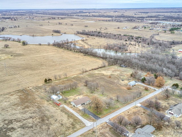 drone / aerial view with a rural view and a water view