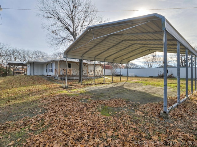 view of vehicle parking with a carport