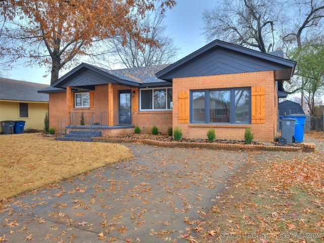 view of front of house featuring brick siding