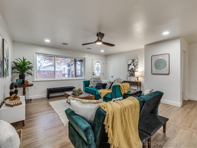 living area featuring a ceiling fan, recessed lighting, light wood-style flooring, and baseboards