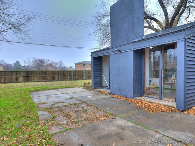 view of yard featuring a patio area and fence