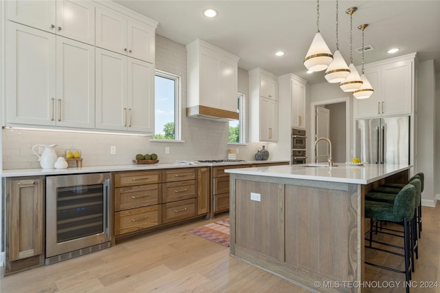 kitchen with white cabinets and beverage cooler