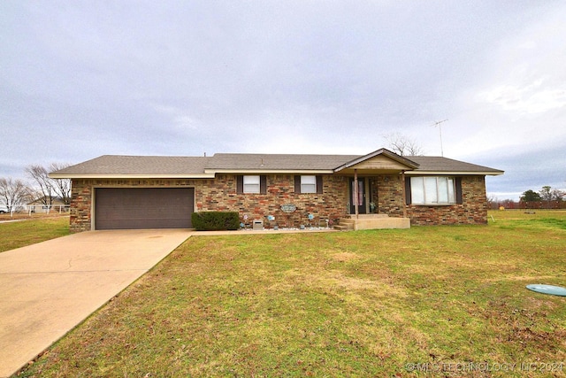 single story home featuring a front yard and a garage