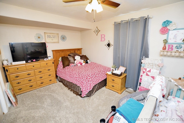 bedroom featuring ceiling fan and light carpet