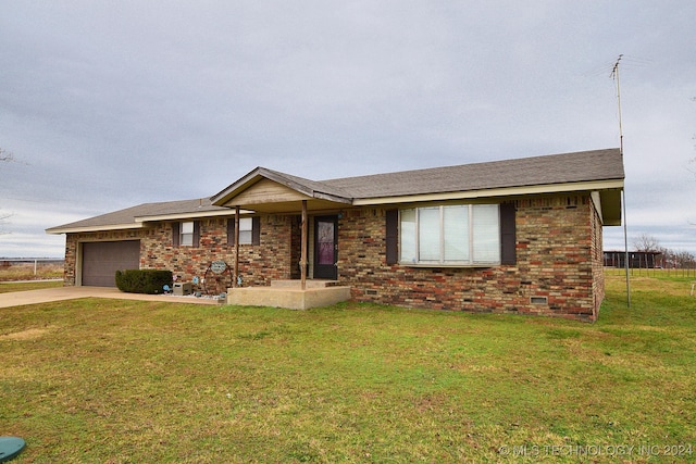 ranch-style home with a front yard and a garage