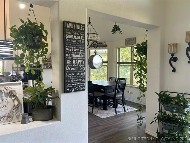 dining room with dark hardwood / wood-style flooring