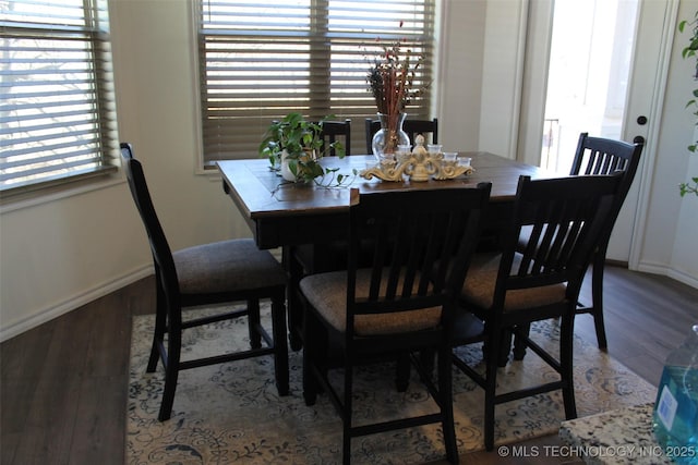 dining room featuring a healthy amount of sunlight and light hardwood / wood-style floors